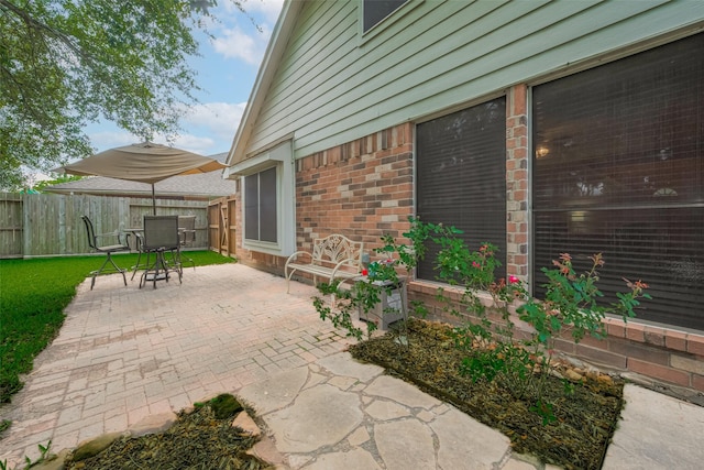 view of patio / terrace featuring fence
