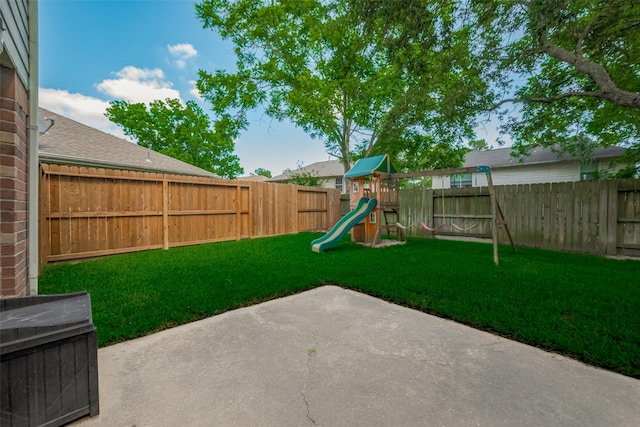 view of yard featuring a patio area and a playground