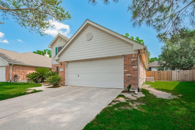view of front facade with brick siding and concrete driveway