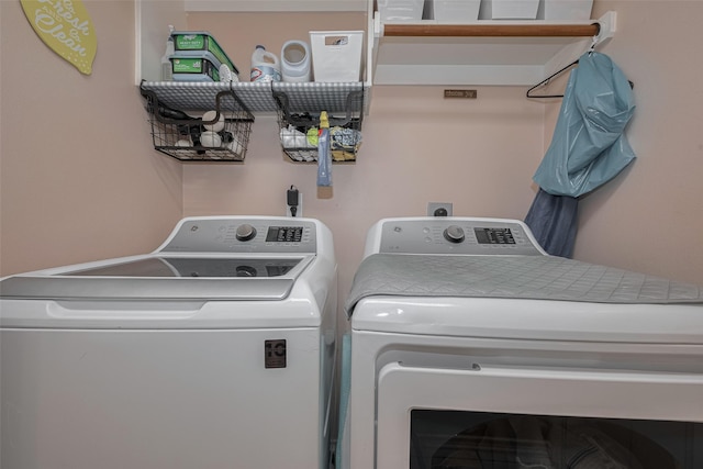 clothes washing area featuring washing machine and clothes dryer