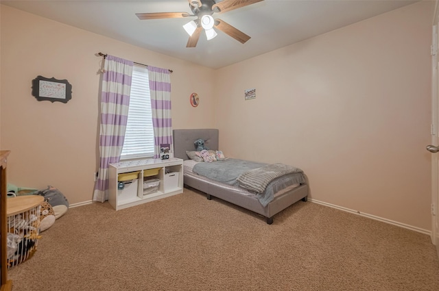 bedroom featuring carpet flooring, baseboards, and ceiling fan