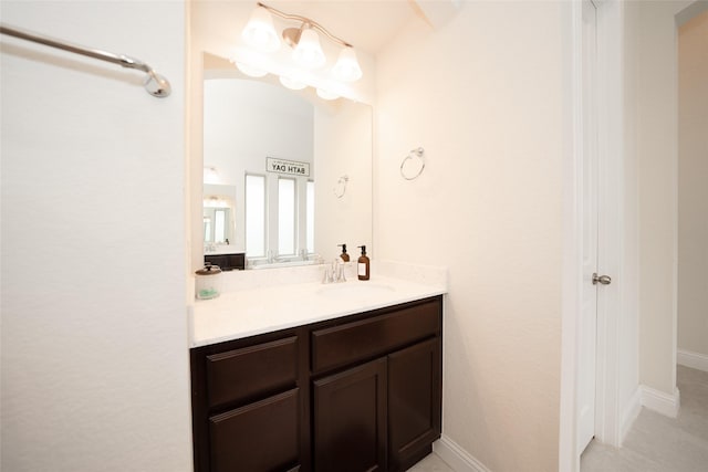 bathroom with vanity and baseboards