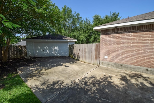 view of patio with a garage and fence