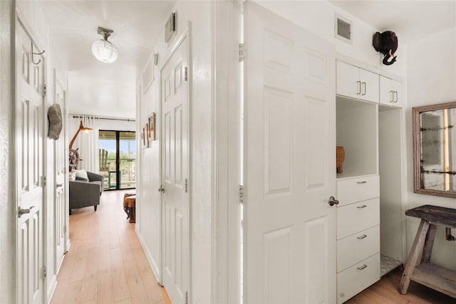 6102 Seawall Blvd Unit 290, Galveston, TX 77551 - hallway featuring light wood-style floors