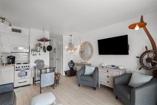 6102 Seawall Blvd Unit 290, Galveston, TX 77551 - living area with light wood-style floors