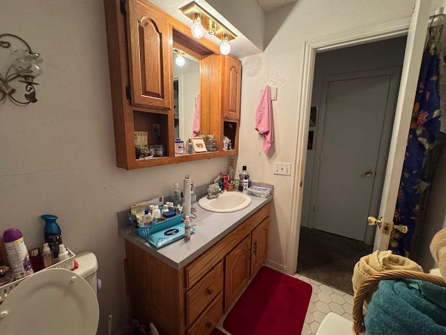 1450 Allegro Dr, Dallas, TX 75241 - bathroom featuring toilet and vanity