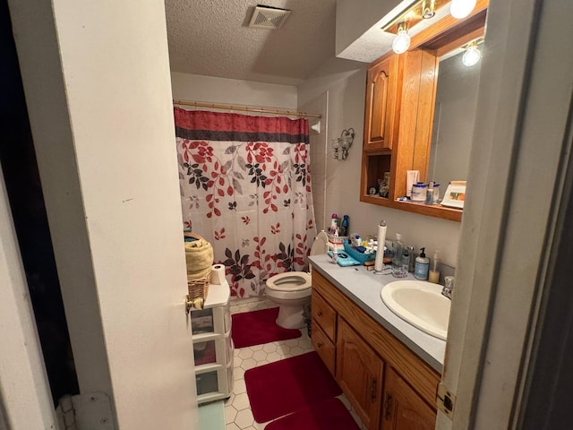 1450 Allegro Dr, Dallas, TX 75241 - full bathroom with vanity, a textured ceiling, toilet, tile patterned floors, and curtained shower