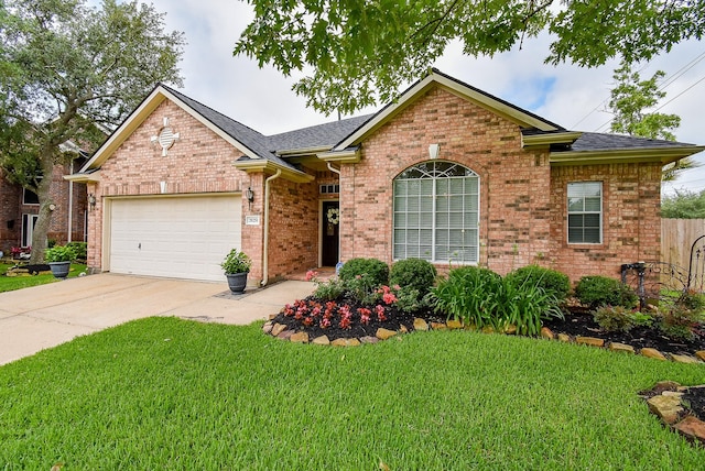 ranch-style home featuring an attached garage, a front yard, driveway, brick siding, and a shingled roof