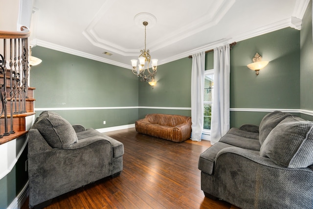 4343 Schlipf Rd, Katy, TX 77493 - living room featuring a tray ceiling, wood finished floors, crown molding, and a chandelier