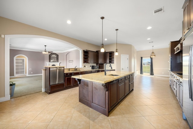 4343 Schlipf Rd, Katy, TX 77493 - kitchen featuring arched walkways, open shelves, a sink, dark brown cabinets, and recessed lighting