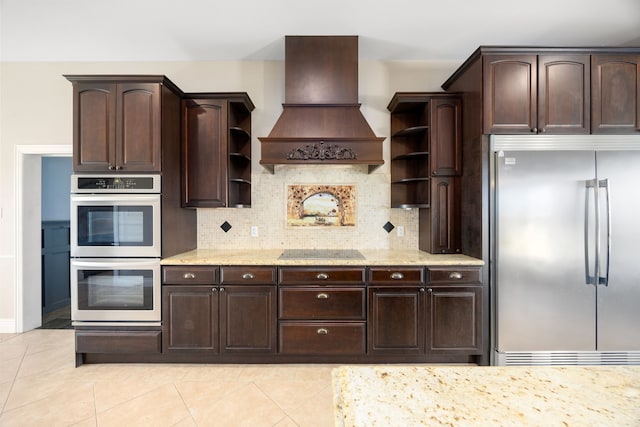 4343 Schlipf Rd, Katy, TX 77493 - kitchen with stainless steel appliances, open shelves, custom exhaust hood, and dark brown cabinetry