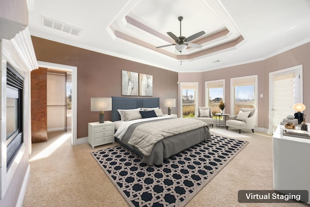 4343 Schlipf Rd, Katy, TX 77493 - bedroom with a tray ceiling, light carpet, ornamental molding, and baseboards