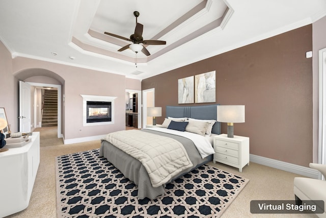 4343 Schlipf Rd, Katy, TX 77493 - bedroom featuring a raised ceiling, light carpet, crown molding, and baseboards