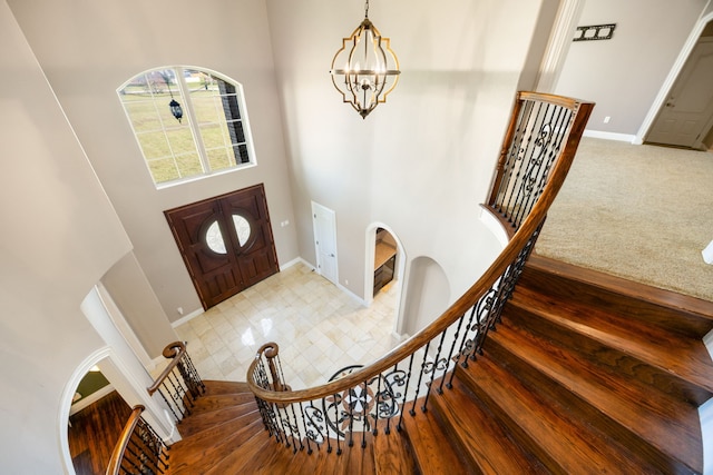 4343 Schlipf Rd, Katy, TX 77493 - foyer entrance with a towering ceiling, stairs, a chandelier, and baseboards