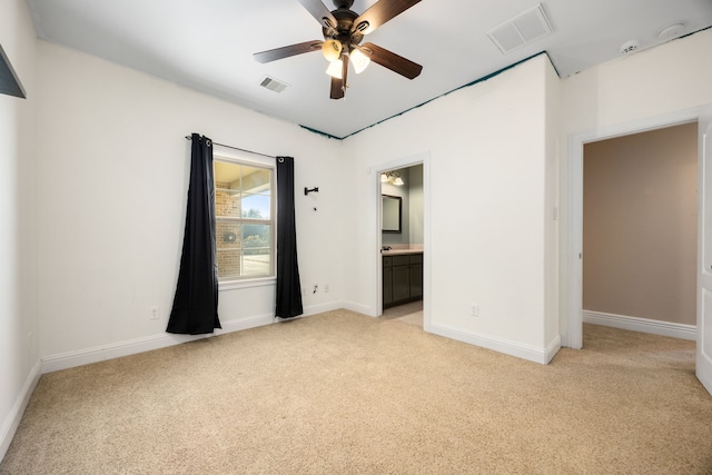 4343 Schlipf Rd, Katy, TX 77493 - unfurnished bedroom with light carpet, baseboards, ensuite bathroom, and ceiling fan