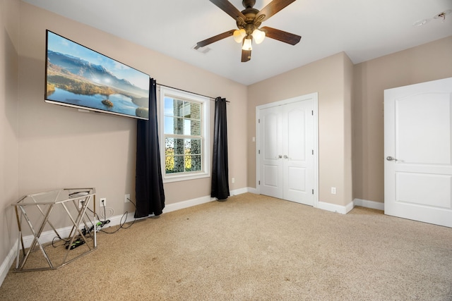 4343 Schlipf Rd, Katy, TX 77493 - unfurnished bedroom featuring carpet, baseboards, and ceiling fan