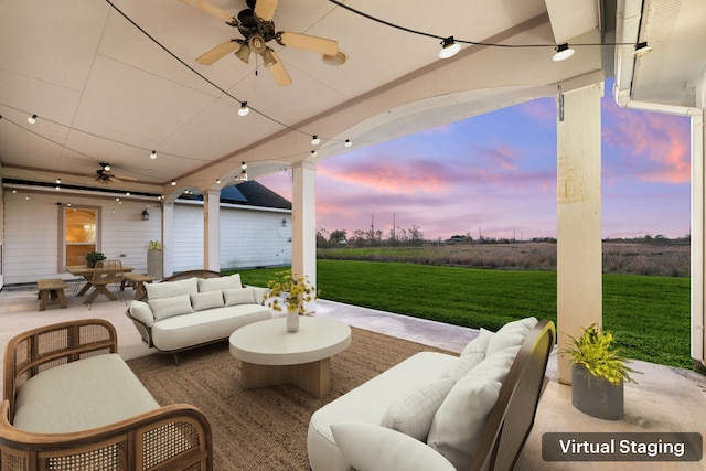 4343 Schlipf Rd, Katy, TX 77493 - patio terrace at dusk featuring outdoor lounge area, a ceiling fan, a lawn, and outdoor dining space