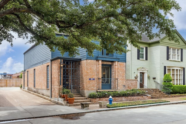 7603 Olympia Dr, Houston, TX 77063 - view of front of property featuring brick siding and fence