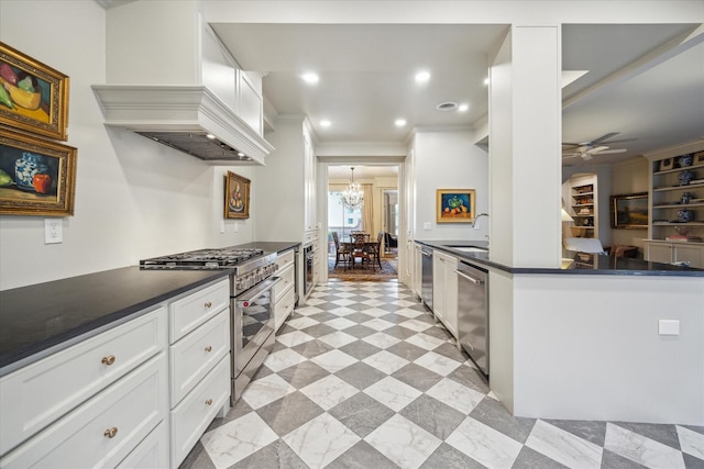 7603 Olympia Dr, Houston, TX 77063 - kitchen featuring appliances with stainless steel finishes, dark countertops, ornamental molding, a chandelier, and premium range hood