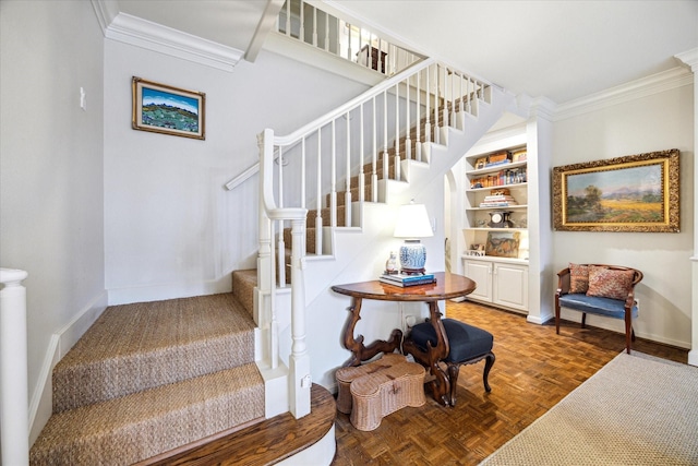 7603 Olympia Dr, Houston, TX 77063 - staircase featuring crown molding, baseboards, and built in shelves