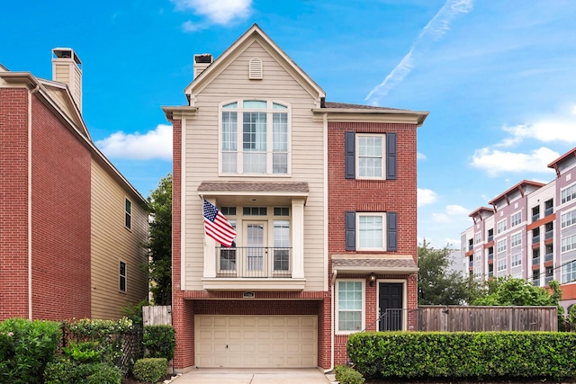 1708 Wilson St, Houston, TX 77019 - traditional-style home featuring brick siding, driveway, a garage, a balcony, and a chimney