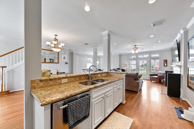 1708 Wilson St, Houston, TX 77019 - kitchen with a sink, stainless steel dishwasher, decorative columns, ornamental molding, and recessed lighting
