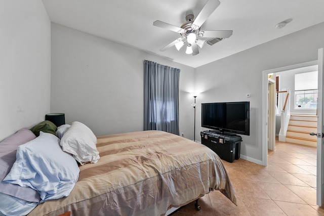 1708 Wilson St, Houston, TX 77019 - bedroom with light tile patterned flooring, a ceiling fan, and baseboards