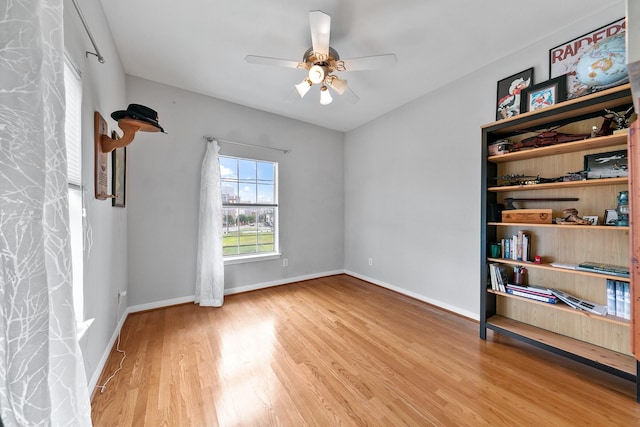 1708 Wilson St, Houston, TX 77019 - unfurnished room with wood finished floors, a ceiling fan, and baseboards