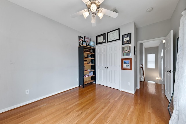 1708 Wilson St, Houston, TX 77019 - unfurnished bedroom featuring light wood-type flooring, a closet, baseboards, and a ceiling fan