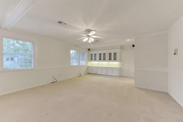 unfurnished room with a ceiling fan, light colored carpet, and baseboards