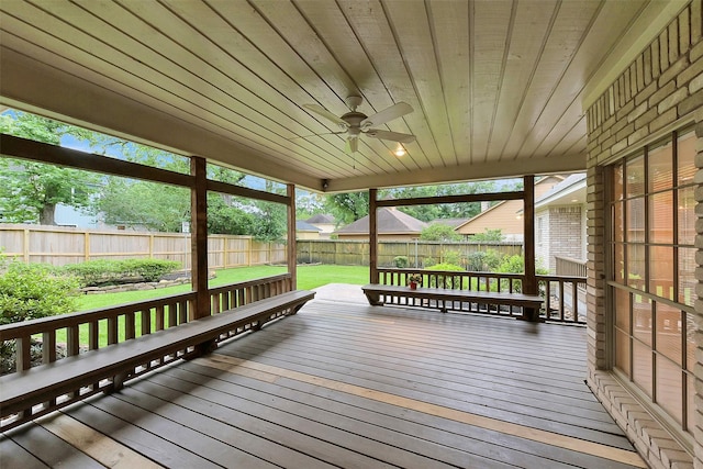 wooden deck featuring ceiling fan
