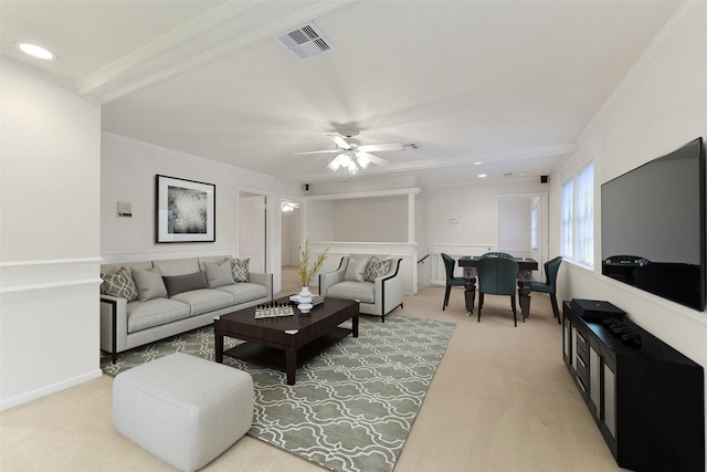 living room with light colored carpet, ceiling fan, ornamental molding, and recessed lighting