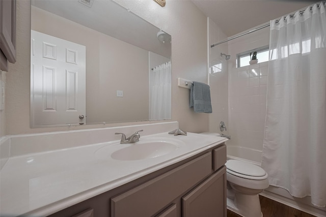 full bath featuring toilet, shower / bathtub combination with curtain, vanity, and wood finished floors