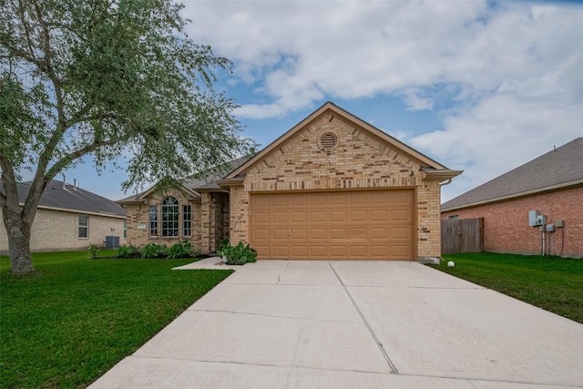 ranch-style house with a garage, brick siding, driveway, and cooling unit