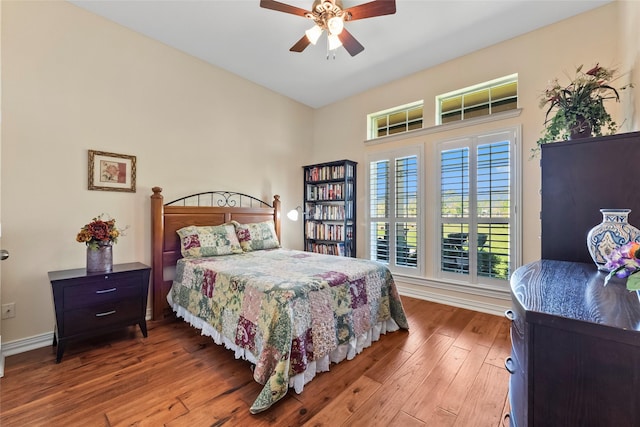 11413 7th St, Santa Fe, TX 77510 - bedroom featuring hardwood / wood-style flooring, baseboards, and ceiling fan