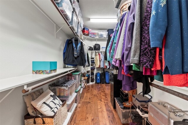 11413 7th St, Santa Fe, TX 77510 - walk in closet featuring wood finished floors