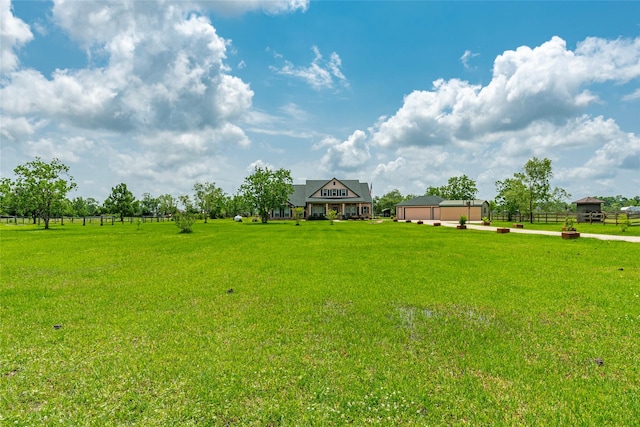 11413 7th St, Santa Fe, TX 77510 - view of yard featuring a garage
