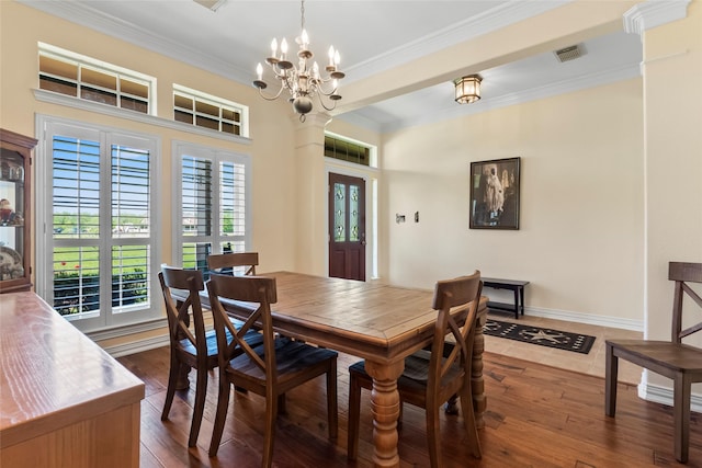 11413 7th St, Santa Fe, TX 77510 - dining room with ornamental molding, a chandelier, dark wood-style flooring, and baseboards