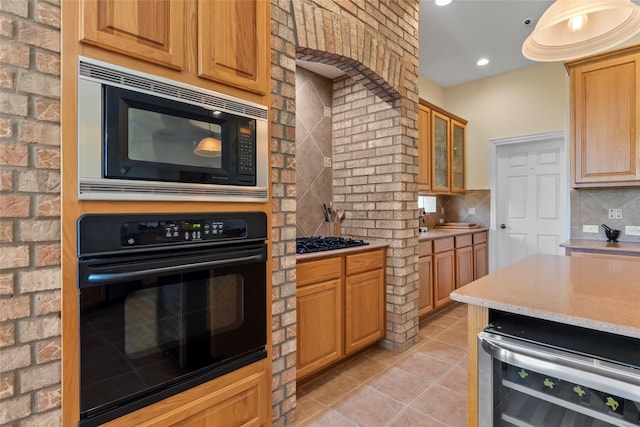 11413 7th St, Santa Fe, TX 77510 - kitchen featuring black appliances, wine cooler, light countertops, light tile patterned floors, and recessed lighting