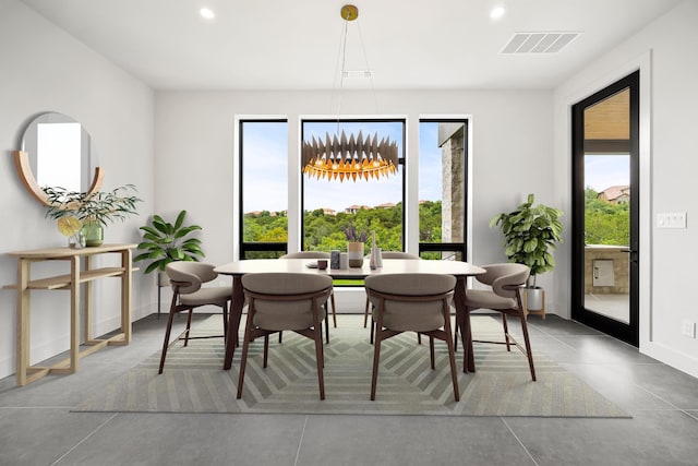 dining space with recessed lighting, baseboards, and a chandelier