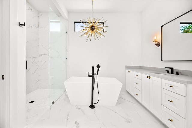 full bath with marble look tile flooring, a chandelier, a marble finish shower, vanity, and a soaking tub