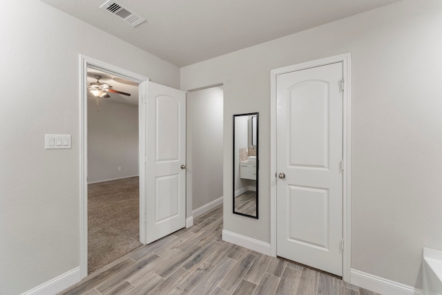 unfurnished bedroom featuring baseboards and light wood-style floors