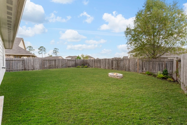 view of yard featuring a fire pit