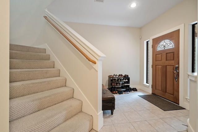 entrance foyer featuring stairway, light tile patterned flooring, and recessed lighting