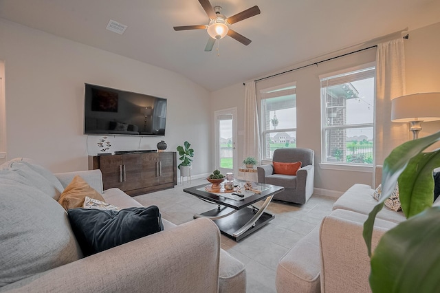 4314 Reese Ravine Ln, Katy, TX 77493 - living room featuring vaulted ceiling, light tile patterned floors, baseboards, and a ceiling fan