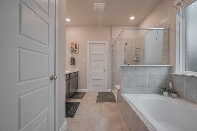 4314 Reese Ravine Ln, Katy, TX 77493 - full bathroom with a shower stall, a garden tub, vanity, tile patterned floors, and recessed lighting