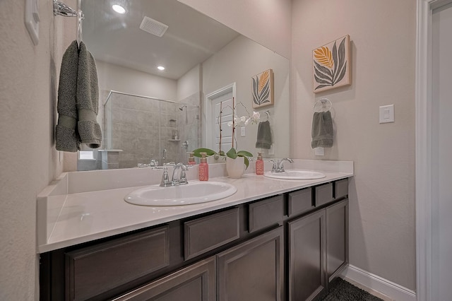 4314 Reese Ravine Ln, Katy, TX 77493 - full bathroom with double vanity, a shower stall, and baseboards
