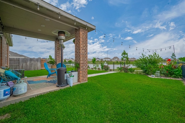 4314 Reese Ravine Ln, Katy, TX 77493 - view of yard featuring a patio area and a water view