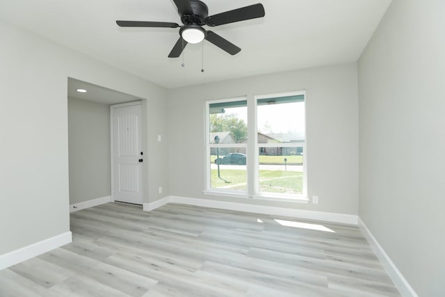 5506 Karelian Dr, Houston, TX 77091 - empty room with baseboards, light wood-style floors, and a ceiling fan