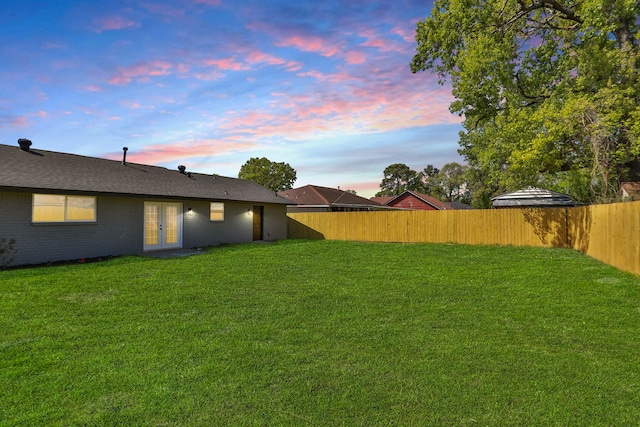 5506 Karelian Dr, Houston, TX 77091 - yard at dusk with french doors